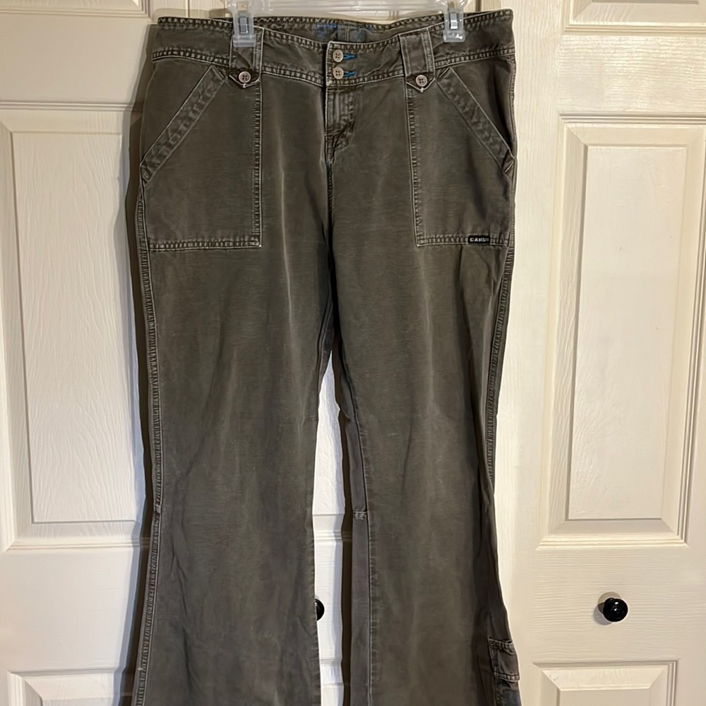 Women’s cars, jeans, distressed green, 38 inch waist inseam, 31.5. Boot cut ,